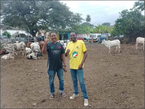 TTU Adwumawura facilitator with a beneficiary at his farm site