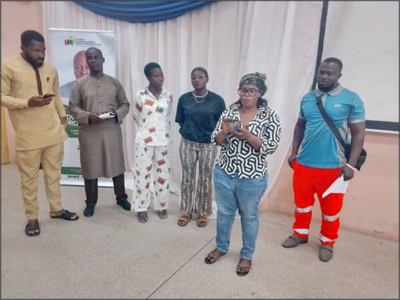 Adwumawura beneficiaries in a group presentation session
